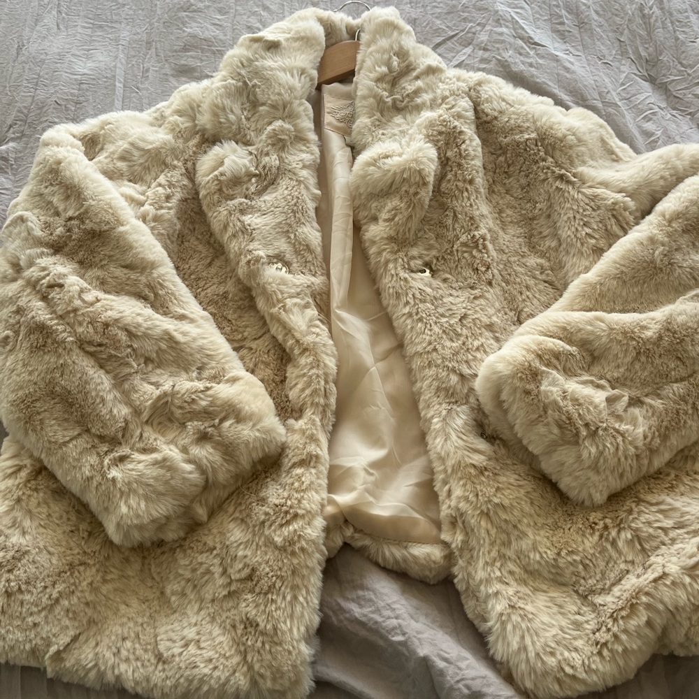 Jou Jou faux fur coat. Worn once. Two button closure has pockets.